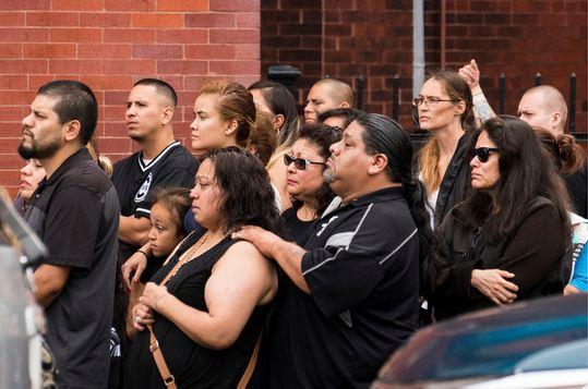 Family and friends watch as the caskets with victims from the Little Village fire are carried out of Our Lady Of Tepeyac church in Chicago on Saturday, Sept. 1, 2018. The fire early Sunday, Aug. 26, 2018 was the city's deadliest blaze in more than a decade. It started in the rear of an apartment building during a sleepover, killing 14-year-old Cesar Contreras, 13-year-old Nathan Contreras, 11-year-old Xavier Contreras, 5-year-old Ariel Garcia, 3-month-old Amayah Almaraz and their cousin, 14-year-old Adrian Hernandez. [Photo: AP/Max Herman/Chicago Sun-Times]